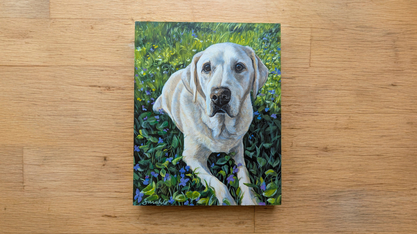Canvas print of a white dog in a grassy field on a wooden surface